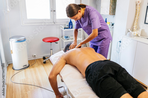 Physiotherapist performing stretching treatment for pain relief