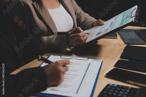 Accounting company provide finance and taxation planning for profitable cash flow, Auditor and accountant team working in office, analyze financial data and accounting record with calculator.Insight