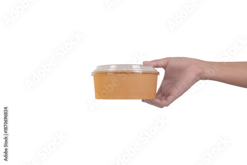 Hand hold Round brown cardboard food container isolated on white background.