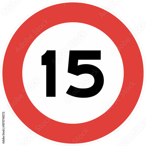 A red and white sign with the number 15 in the center indicating a speed limit.