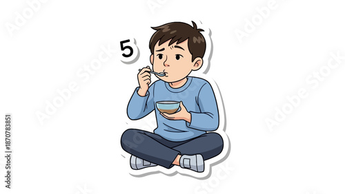 A young boy sitting cross-legged enjoying a meal from a bowl with a spoon in a calm environment
