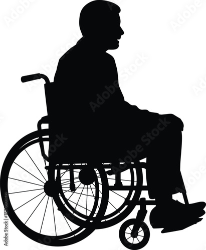 Silhouette of a person sitting in a wheelchair with one leg extended leg