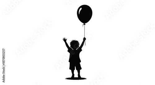 Silhouette of a joyful child holding a balloon