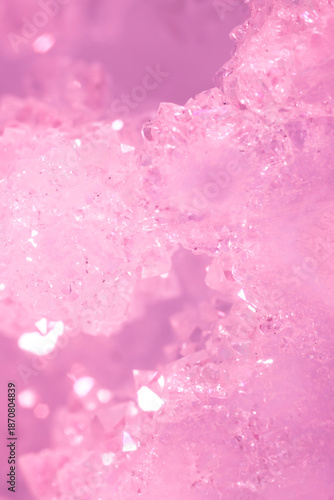 Amethyst pink crystals. Gems. Mineral crystals in the natural environment. Texture of precious and semiprecious stones. Seamless background with copy space colored shiny surface of precious stones.