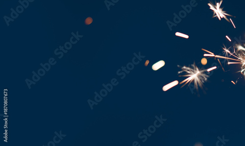 Wallpaper Mural Holiday background made with blurred sparks from sparklers on dark backdrop with copy space Torontodigital.ca