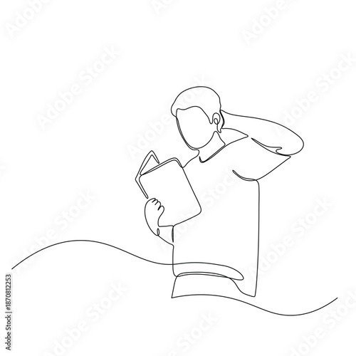 Man reading a book with a contemplative expression.