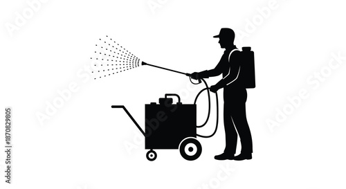 A worker spraying liquid with a machine a striking silhouette