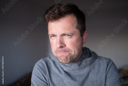 Obraz na plátne Suspicious male person looking with disbelief, doubt and judgment
