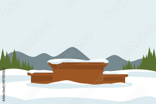 Winter sports podium sits covered in fresh snow against mountains.