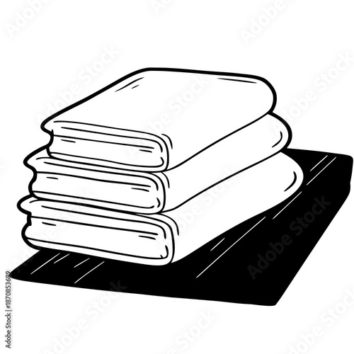 Stack of clean towels neatly arranged on a black surface  