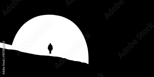 Silhouette of lone figure walking through dark tunnel against bright light