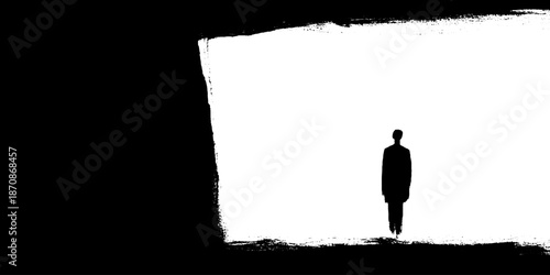 Lonely silhouette of man in abstract black and white composition