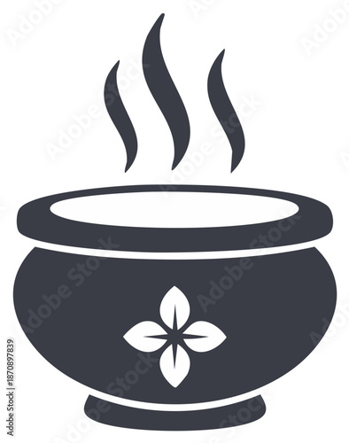 Warm steaming bowl with decorative floral motif rising vapor