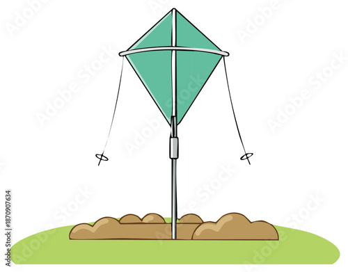 Green diamond kite anchored to the ground with a pole and dirt mounds