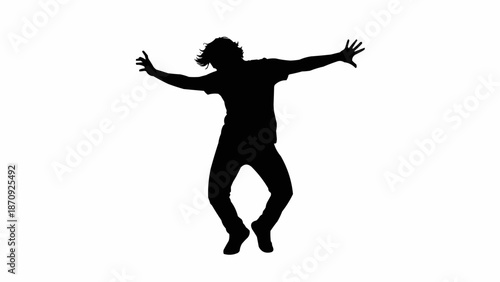 Silhouette of a person dancing energetically with arms outstretched.
