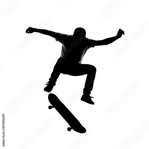 Silhouette of a skateboarder performing a trick in mid-air.