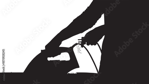 Silhouette of a person plugging an electrical cord