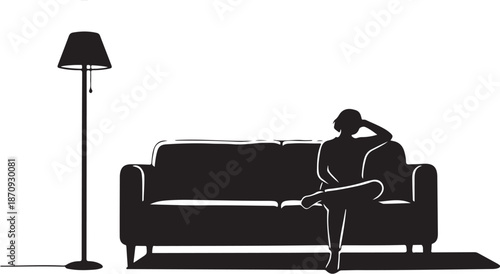 Woman sitting on couch with floor lamp beside