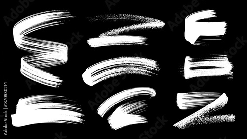 Collection of nine white hand-painted brush stroke elements with textured lines on a black background, art graphic resources
