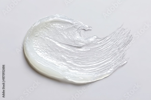 Hydrating Vaseline Application. Dollop of creamy skin care product. Glossy balm texture. Petroleum jelly ointment swatch. Swoosh swatch sample cosmetics. Facial jelly, cleanser. Drop isolate on white.