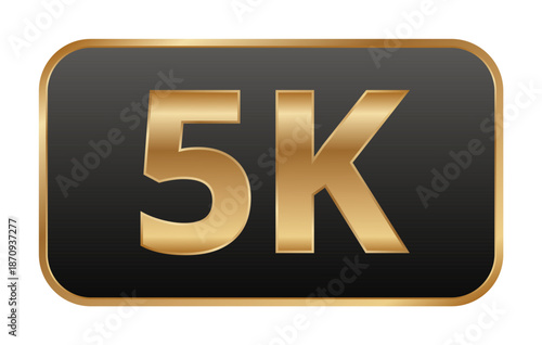 Gold 5k badge with black background symbolizing milestone.