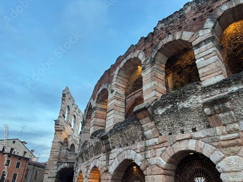 Colosseo in Verona, Italy close-up across blue sky and other architecture. Ancient Roman architecture