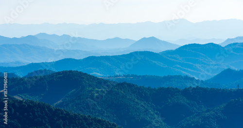 Panoramic view of blue mountain range layers under a clear sky. Mountain scenic nature landscape for peaceful background and travel destination concept in Southeast Asia.