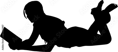 Silhouette of a woman lying down and reading a book