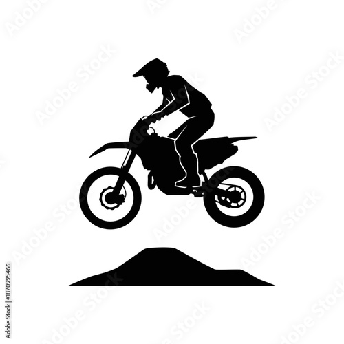 Motorcycle rider in mid air performing stunt