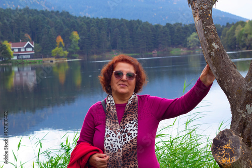portrait of  beautiful woman in the park in Autumn	
