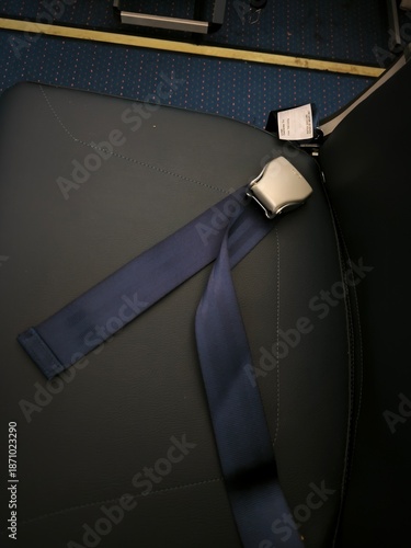 Airplane seatbelt buckle denim dark background nature night nightlife travel travelling tourism black blue orange air atmosphere transport transportation industry technology industrial object