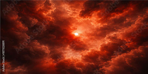 A dramatic orange sunset creates a beautiful abstract texture of fire and smoke within dark stormy clouds for a powerful nature atmosphere