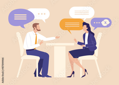 Businessman and businesswoman negotiating agreement at office desk