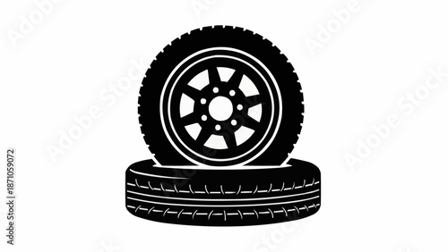 Two black car tires stacked on a white background.