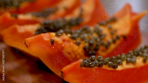 Exotic Textures: A Macro Look at the Succulent Red Interior of a Sliced Papaya.