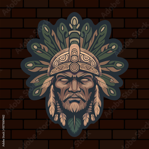 a stern face of a tribal Indian warrior or deity with stylized leaves on his head depicted on a brick wall