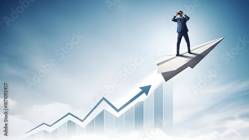 Businessman in blue suit stands on rising arrow graph looking ahead