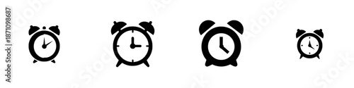 Different sizes and styles of alarm clocks showing time in black and