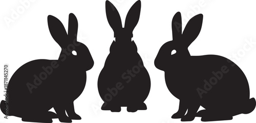Three silhouetted rabbits