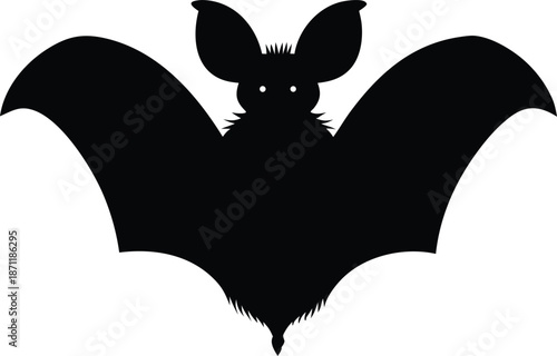 Spooky bat silhouette with wings spread wide flying in the night