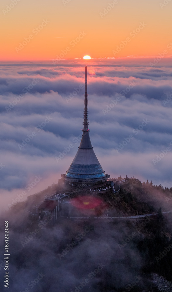 Fototapeta premium Beautiful Sunset over Famous Mountain Hotel Jested , Aerial Shot Above Clouds
