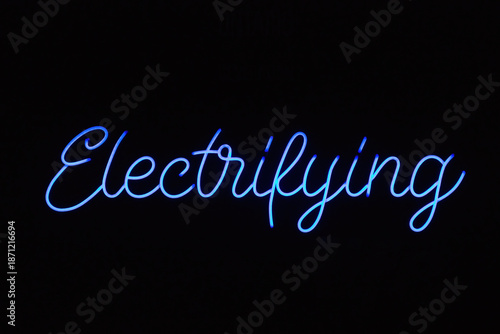 Fotografi electrifying blue neon sign against a dark background