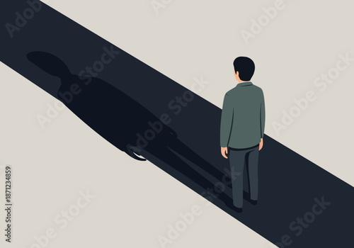 Man stands on a path with a long, dark shadow.