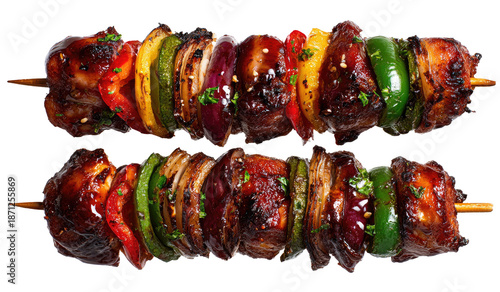 Two skewers of grilled meat and vegetables.  Colorful, grilled kebabs