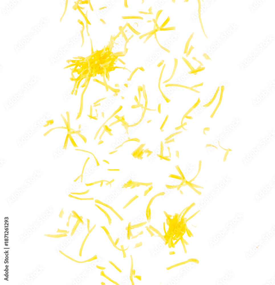 Fototapeta premium Scattered grated yellow cheese isolated on white background, minimal food texture concept for cooking, recipes, advertising, packaging and menu design