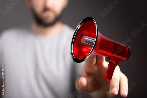 A man's hand pointing with ...
