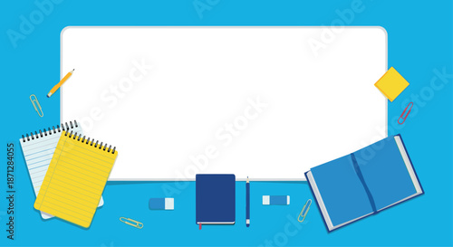 Top view of a clean workspace with books, notebooks, pencils, and erasers surrounding a large white rectangular center space.