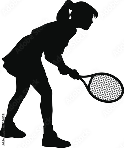 Young girl playing tennis with racket in hand