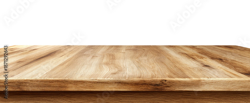 Close-up view of a light brown wooden tabletop against a black background.  The wood grain is visible in horizontal lines