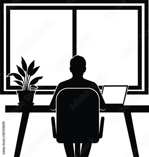 Silhouette of a person sitting at a desk in front of a window with a plant silhouette